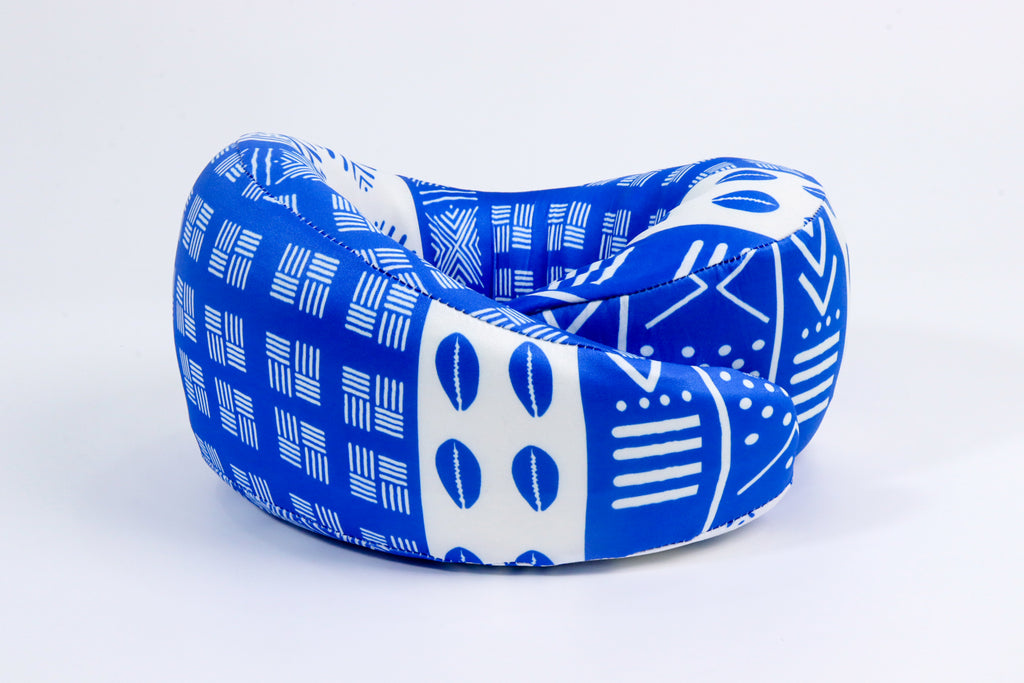 Blue and white mud cloth neck pillow that offers cervical support, soft memory foam that keeps its height while you snooze.