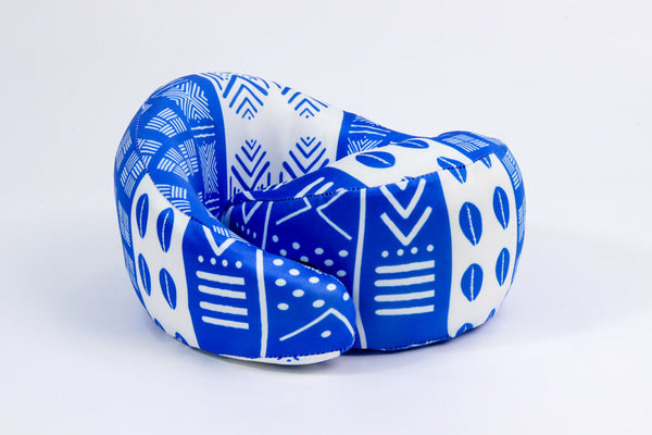 Blue and white mud cloth neck pillow that offers cervical support, soft memory foam that keeps its height while you snooze.